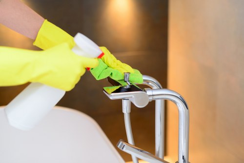 Technician carrying out a stain treatment during carpet cleaning