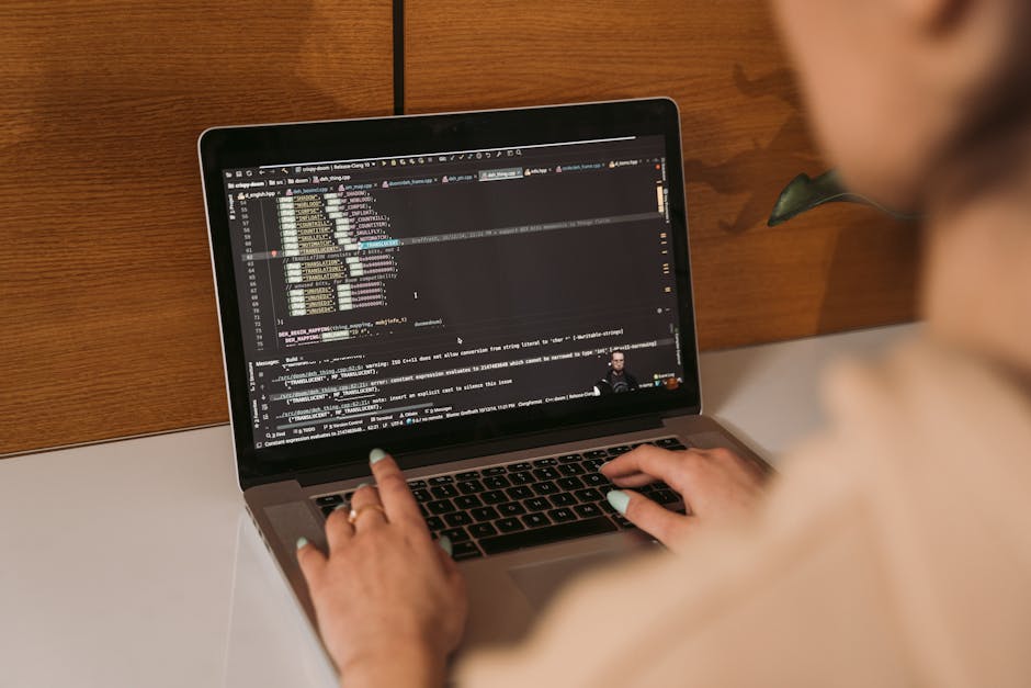A close-up image of a computer screen displaying lines of code with colorful syntax highlighting. The code includes functions, variables, and comments, suggesting software development or web programmi